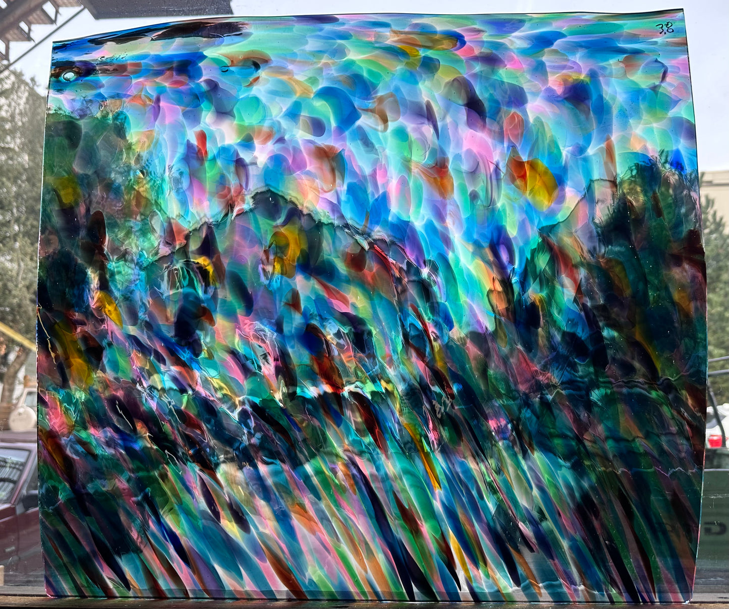 G Multi Multiple colors on clear transparent glass.